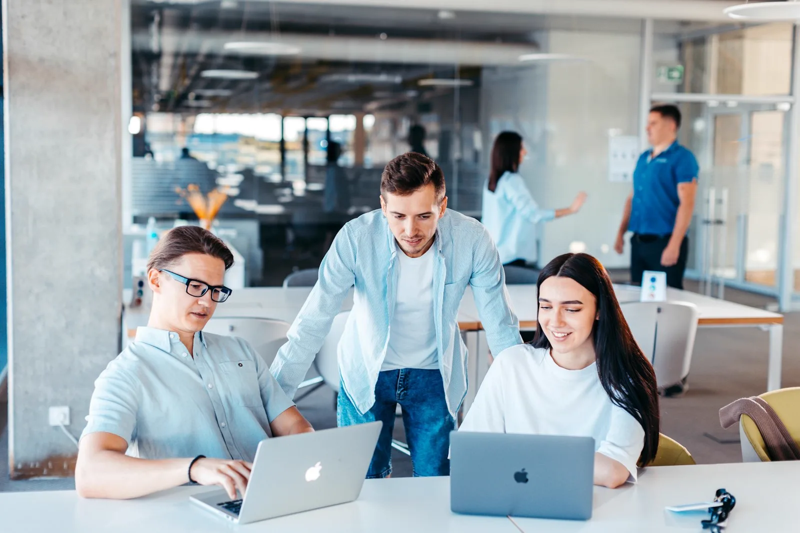 Startup team reviewing work together in a modern office