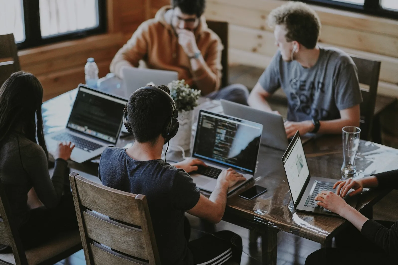 Team of developers working together on laptops